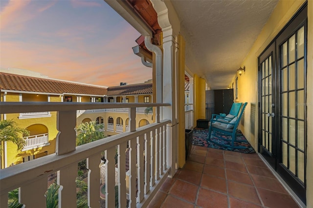 view of balcony at dusk