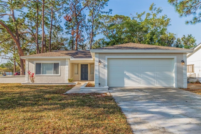 ranch-style home with a garage and a front lawn