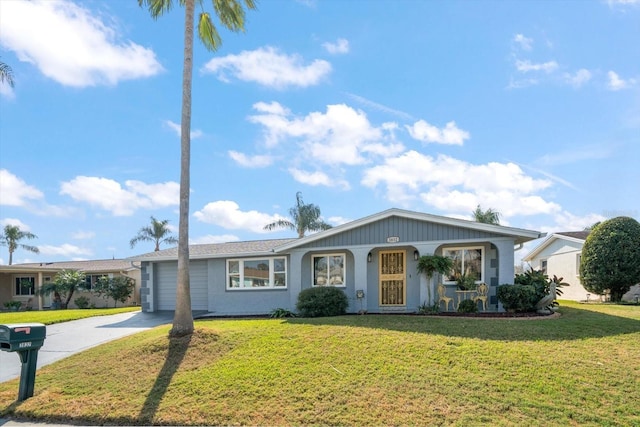 ranch-style house with a garage and a front yard