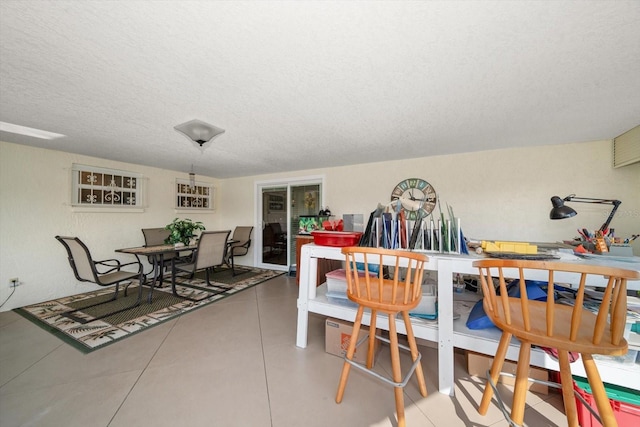 dining room with a textured ceiling