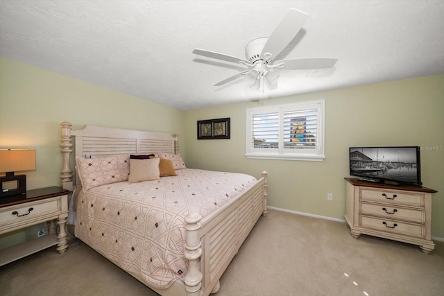 carpeted bedroom featuring ceiling fan, lofted ceiling, and a textured ceiling