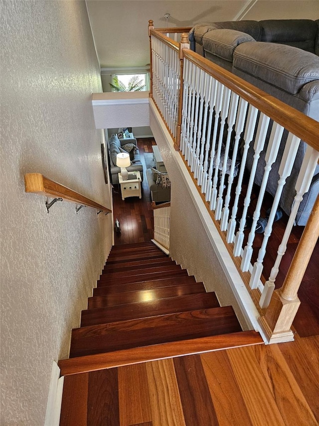 stairs featuring wood-type flooring