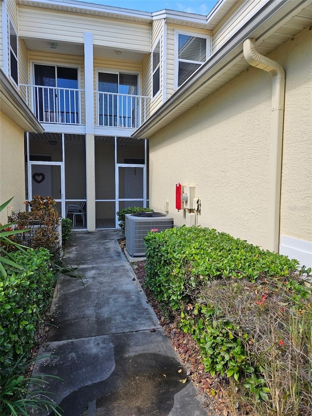 doorway to property featuring central AC