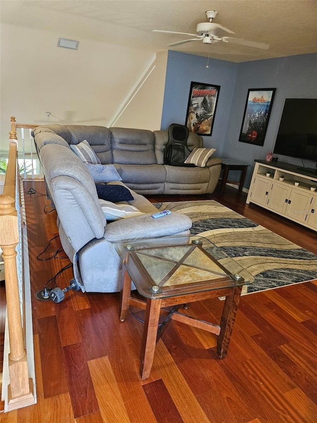 living room featuring hardwood / wood-style flooring and ceiling fan