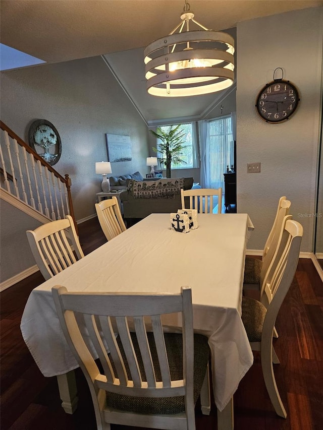 dining space with dark hardwood / wood-style floors