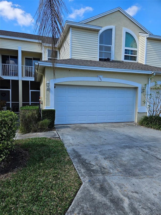 view of front of property with a garage