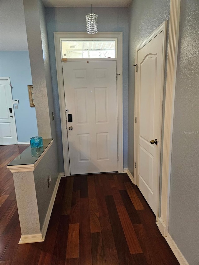 doorway to outside featuring dark hardwood / wood-style flooring