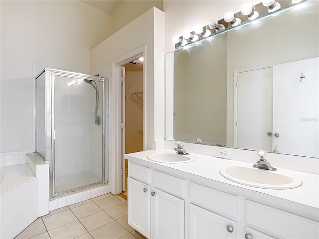 bathroom featuring tile patterned flooring, vanity, and independent shower and bath