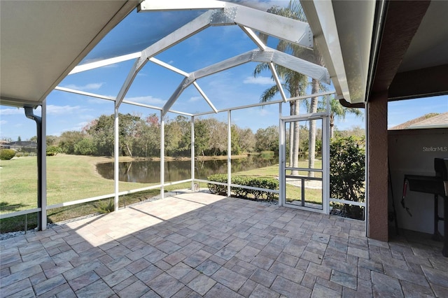 unfurnished sunroom with a water view