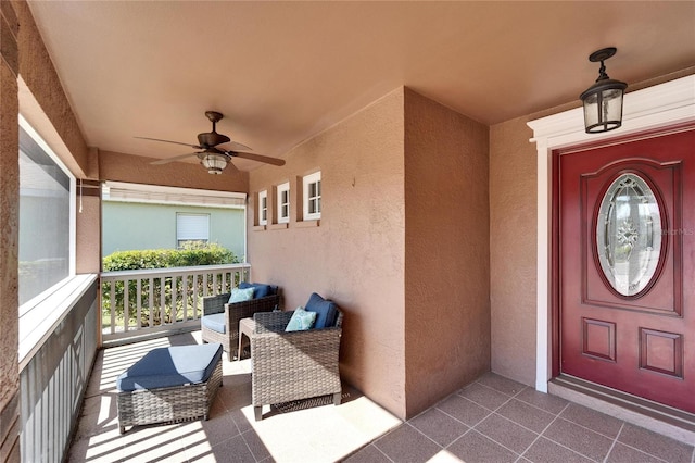 view of exterior entry featuring ceiling fan