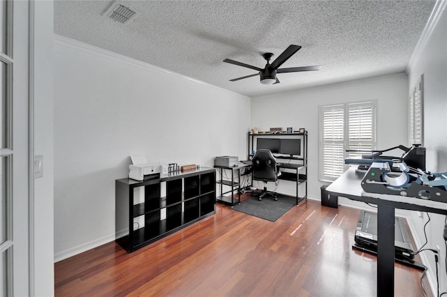 office with hardwood / wood-style flooring, ceiling fan, crown molding, and a textured ceiling