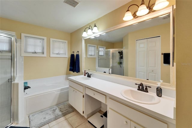 bathroom featuring tile patterned flooring, vanity, and independent shower and bath