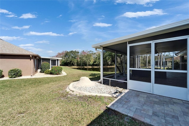 view of yard featuring a sunroom