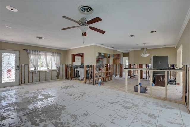 interior space with ornamental molding and ceiling fan