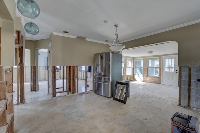 unfurnished dining area featuring ornamental molding