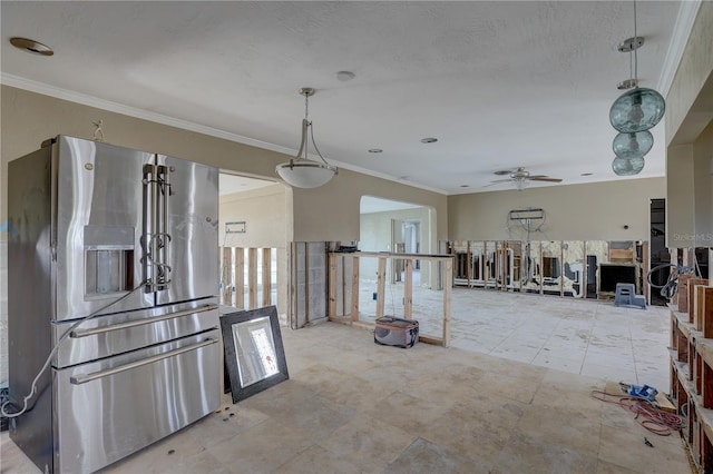 kitchen with crown molding, ceiling fan, stainless steel fridge with ice dispenser, and a textured ceiling