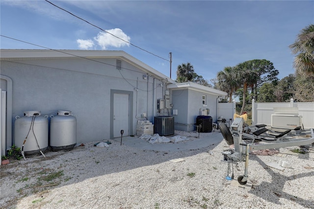 view of side of home with cooling unit