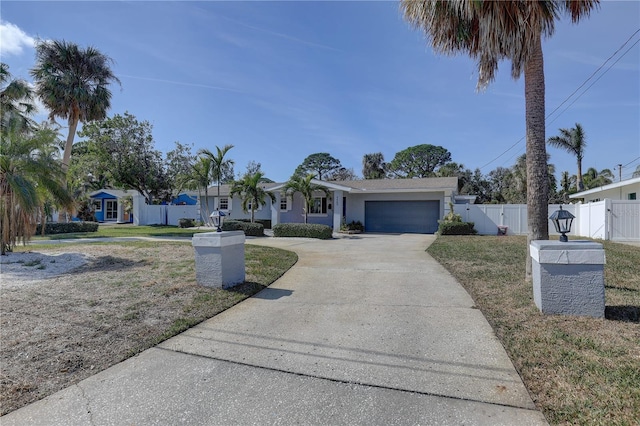 ranch-style house featuring a garage and a front yard