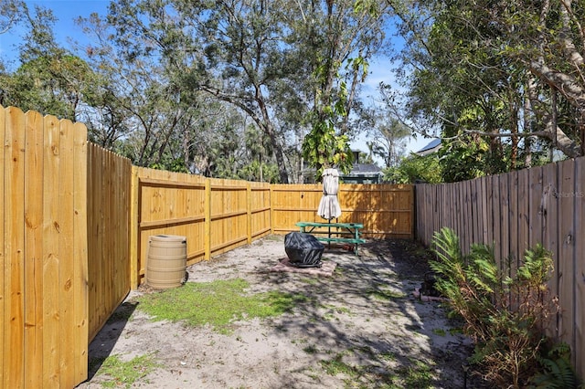 view of yard with a patio area and a fenced backyard