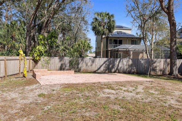 view of yard featuring a patio area and a fenced backyard