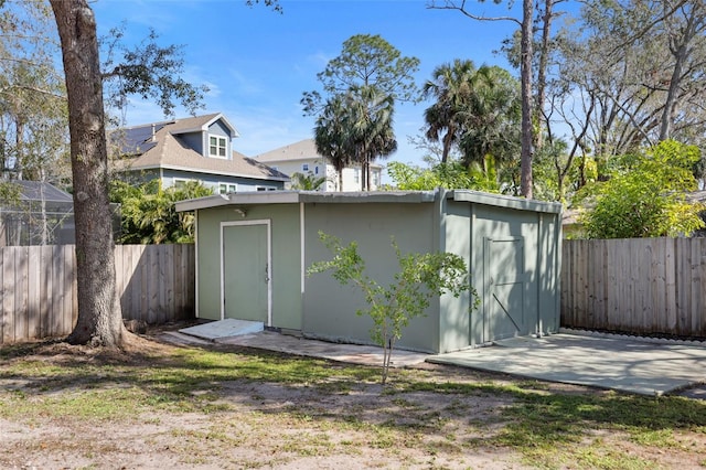 view of shed with a fenced backyard