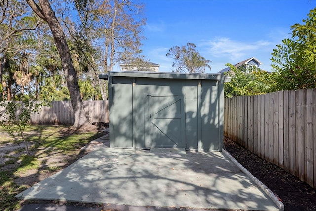 view of shed featuring a fenced backyard