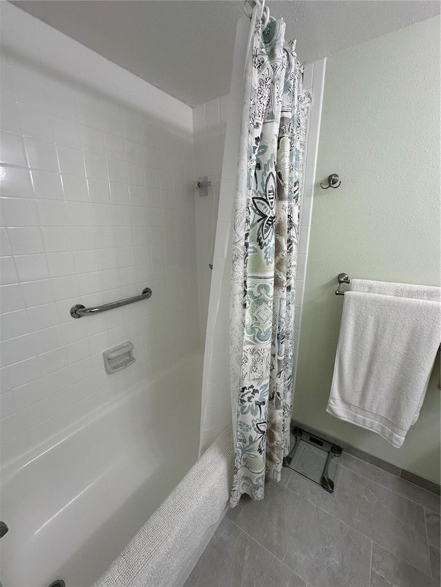 bathroom featuring shower / tub combo with curtain