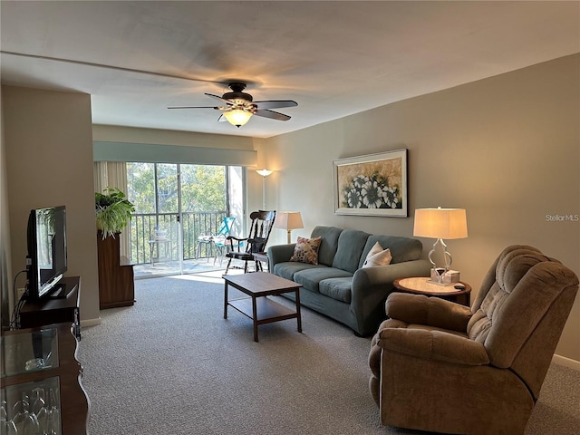 carpeted living room featuring ceiling fan