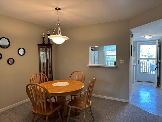 view of carpeted dining space