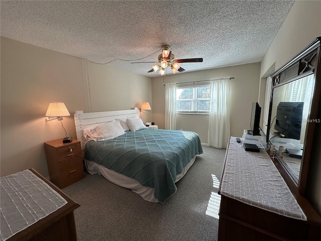 carpeted bedroom with ceiling fan and a textured ceiling