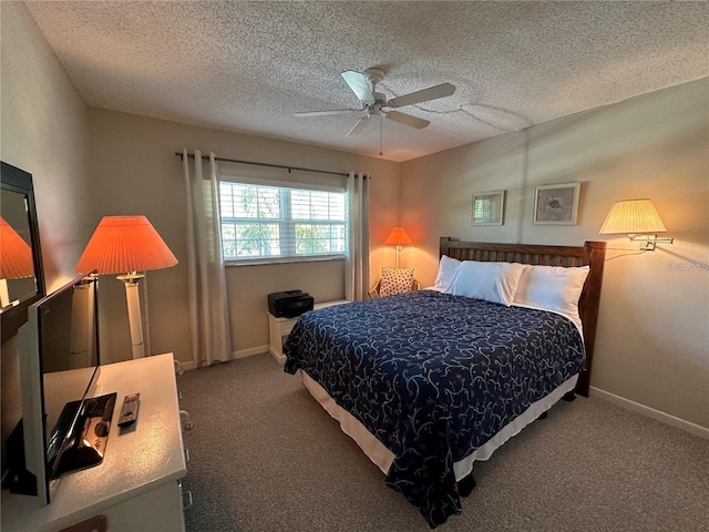 carpeted bedroom with ceiling fan and a textured ceiling