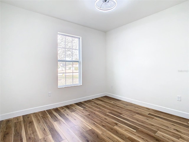 spare room with hardwood / wood-style floors