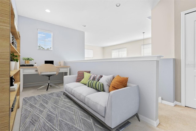 carpeted living room featuring a healthy amount of sunlight