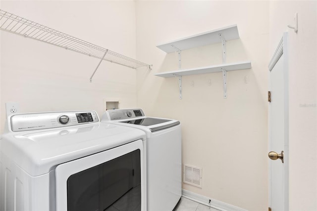 laundry room with washer and dryer