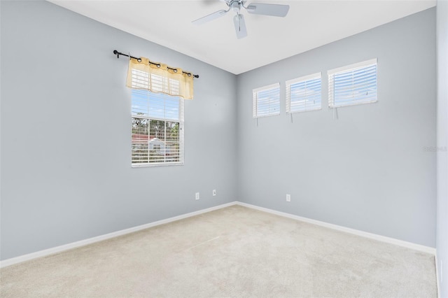 carpeted empty room with ceiling fan