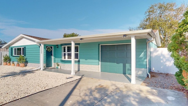 ranch-style home featuring a garage