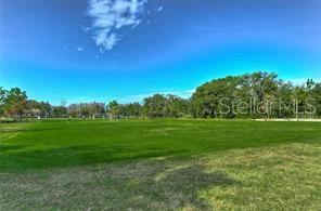 view of home's community featuring a lawn