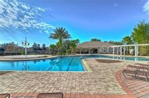 view of pool featuring a patio area