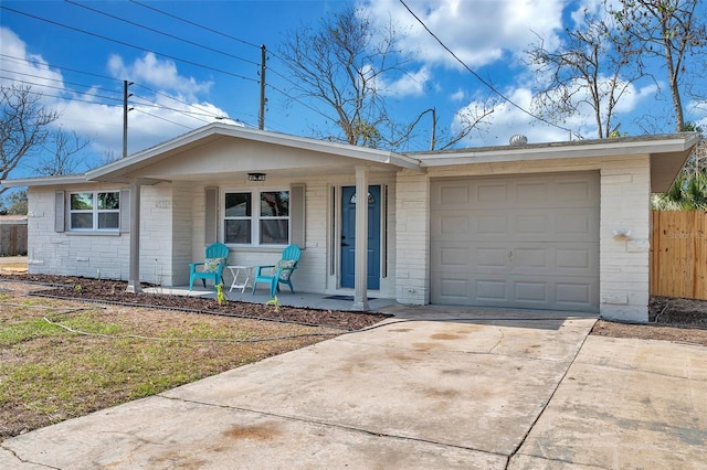 single story home with a garage and a porch