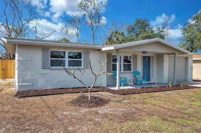 ranch-style home with covered porch