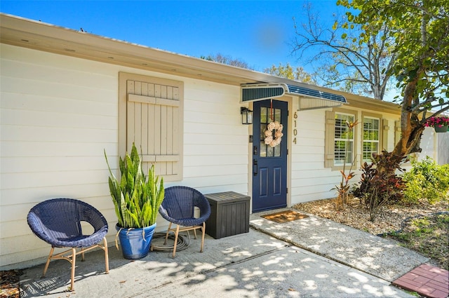 entrance to property with a patio area