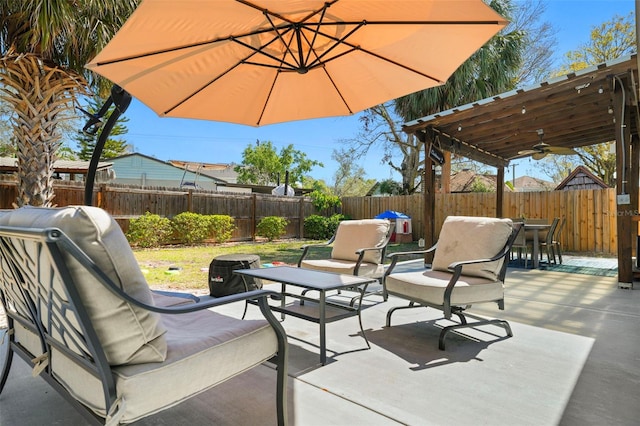 view of patio with a fenced backyard, ceiling fan, and outdoor lounge area