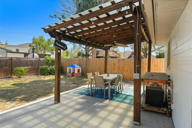 view of patio / terrace with a fenced backyard, ceiling fan, and outdoor dining space