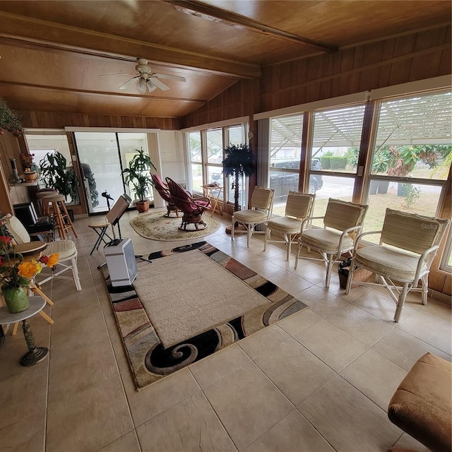 sunroom featuring wood ceiling, ceiling fan, and vaulted ceiling with beams