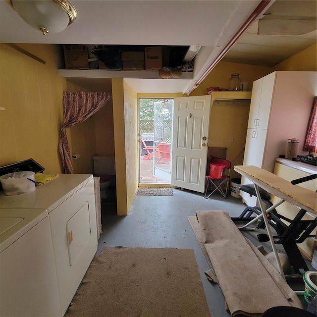 clothes washing area featuring independent washer and dryer