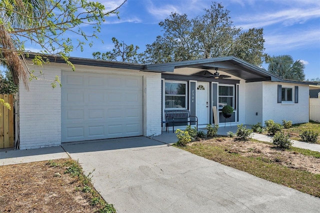 ranch-style home with a garage, ceiling fan, and a porch