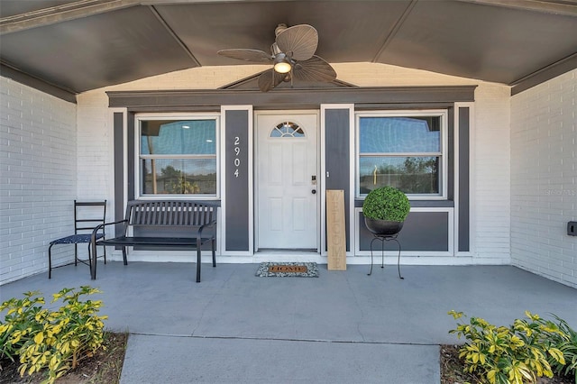 doorway to property featuring ceiling fan