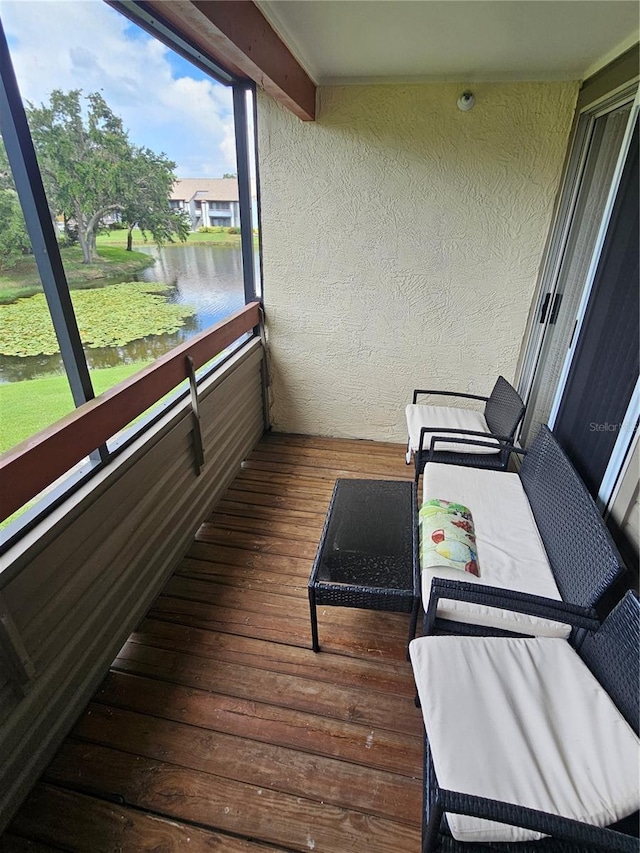 balcony featuring a water view