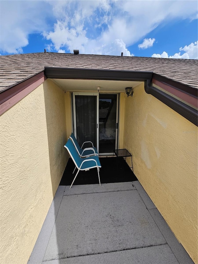 entrance to property with a patio