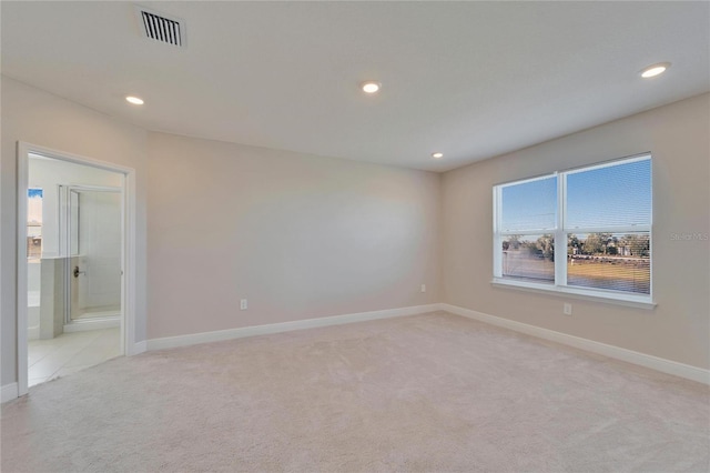 empty room featuring light colored carpet